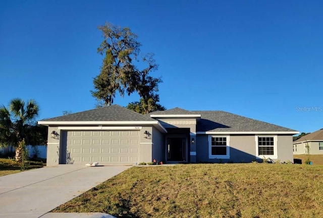 ranch-style house with a garage and a front yard