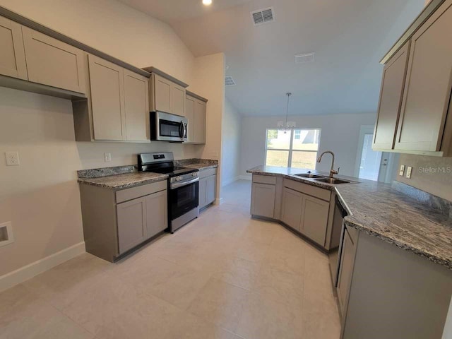 kitchen with vaulted ceiling, decorative light fixtures, stainless steel appliances, a notable chandelier, and sink