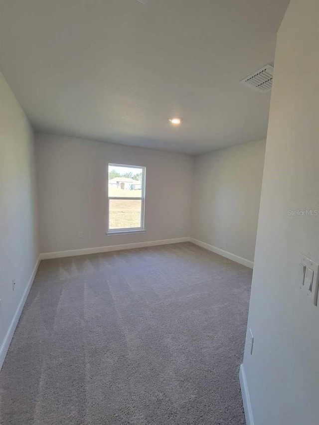 unfurnished room with carpet floors