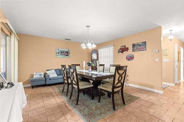 dining area with a chandelier