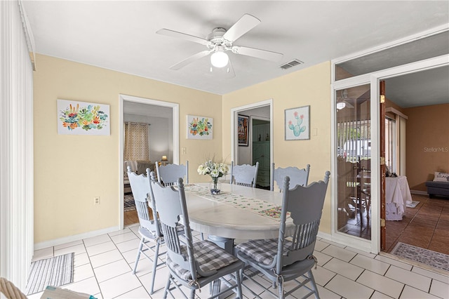 tiled dining room with ceiling fan