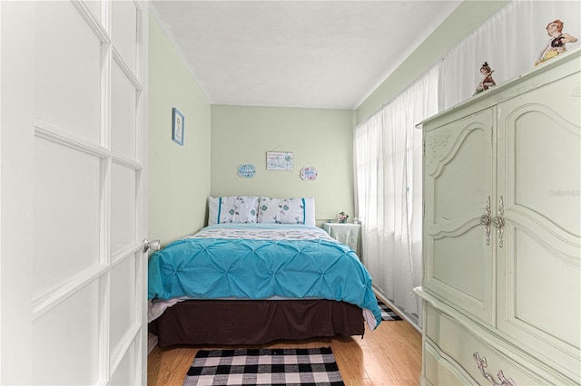 bedroom featuring light wood-type flooring