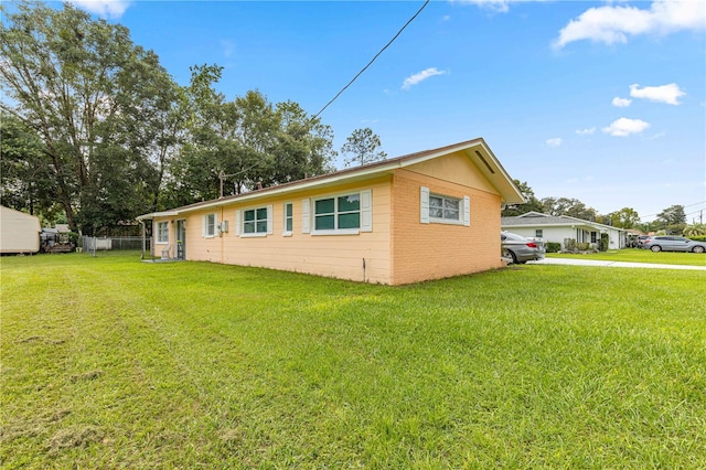 view of property exterior with a lawn