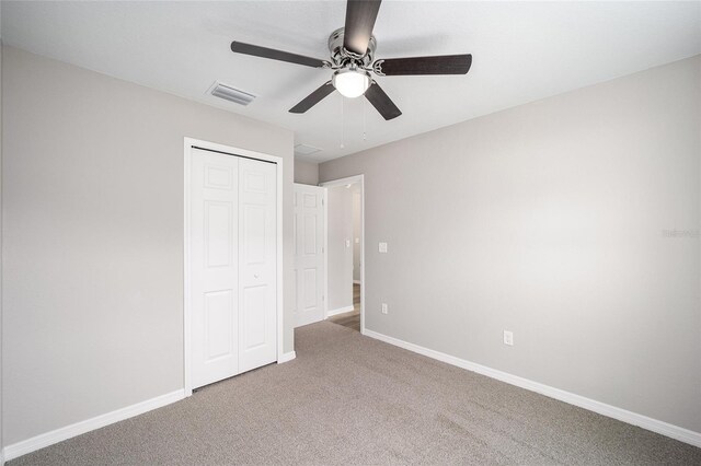 10816 SE 66th Ave, Belleview, FL 34420 - unfurnished bedroom with ceiling fan, carpet floors, baseboards, visible vents, and a closet