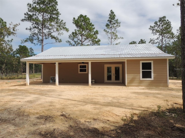 rear view of house featuring french doors