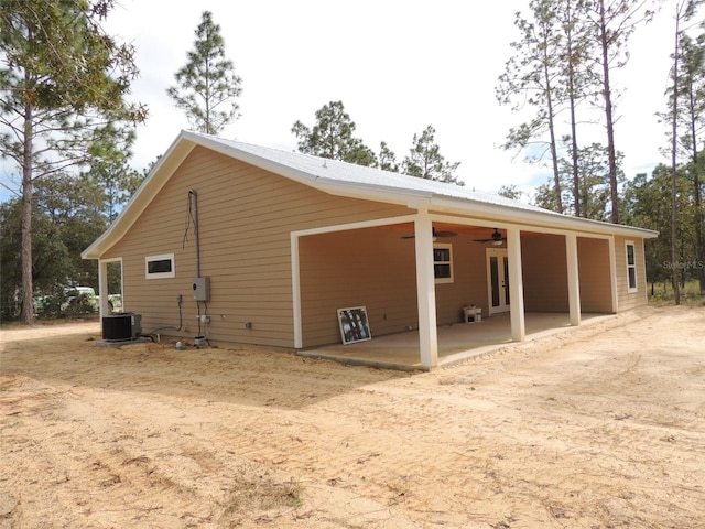 back of house featuring central air condition unit, ceiling fan, and a patio area