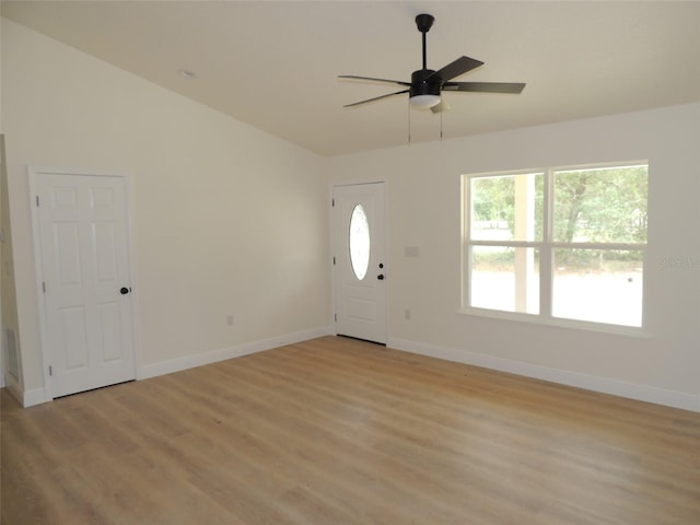 foyer with light hardwood / wood-style floors and ceiling fan