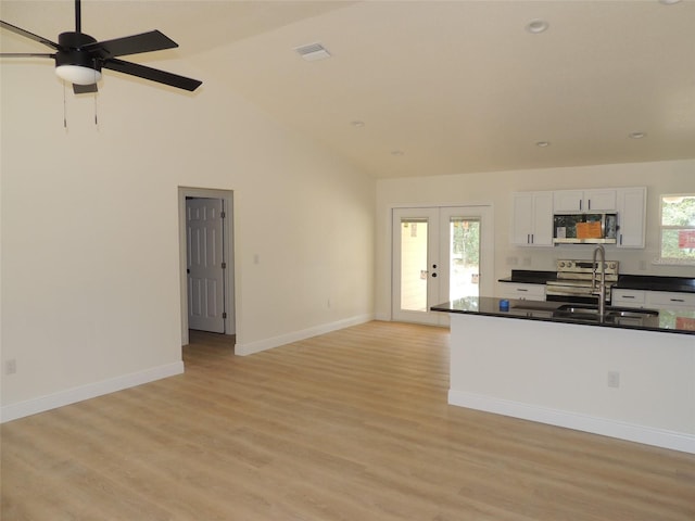 kitchen with white cabinets, plenty of natural light, sink, and appliances with stainless steel finishes