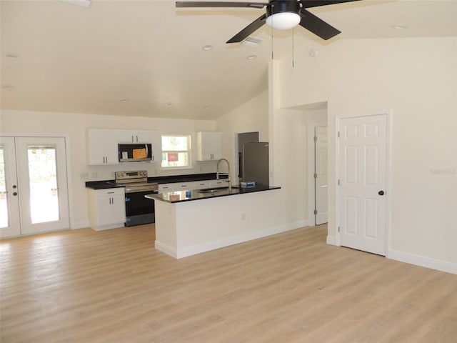 kitchen featuring white cabinetry, sink, appliances with stainless steel finishes, high vaulted ceiling, and light hardwood / wood-style flooring