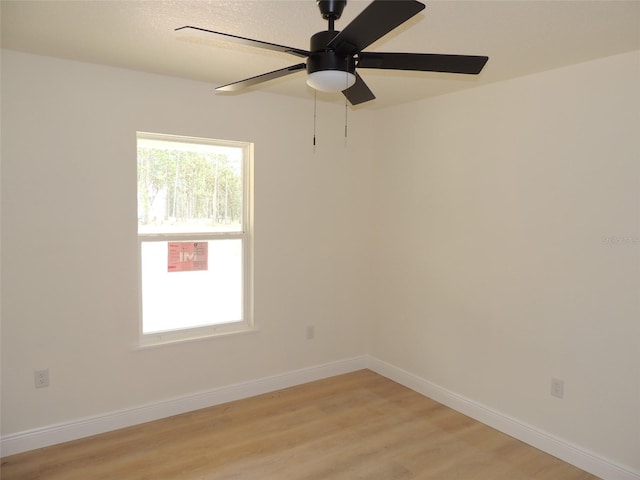 unfurnished room featuring ceiling fan and light wood-type flooring