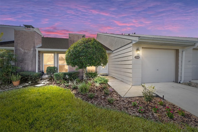 property exterior at dusk featuring a garage