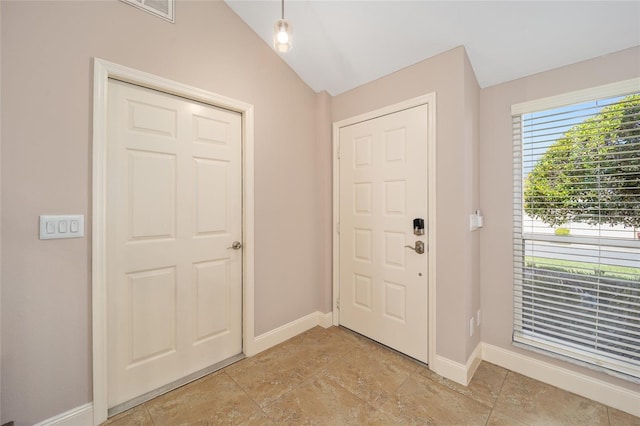 entryway featuring lofted ceiling