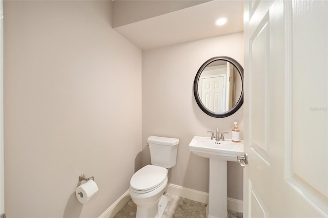 bathroom featuring tile patterned floors and toilet