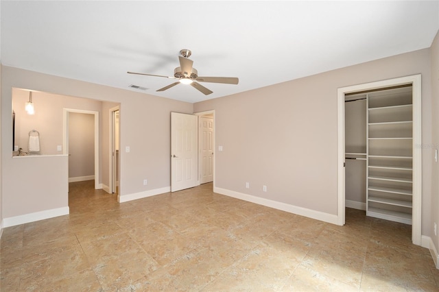 unfurnished bedroom featuring ceiling fan