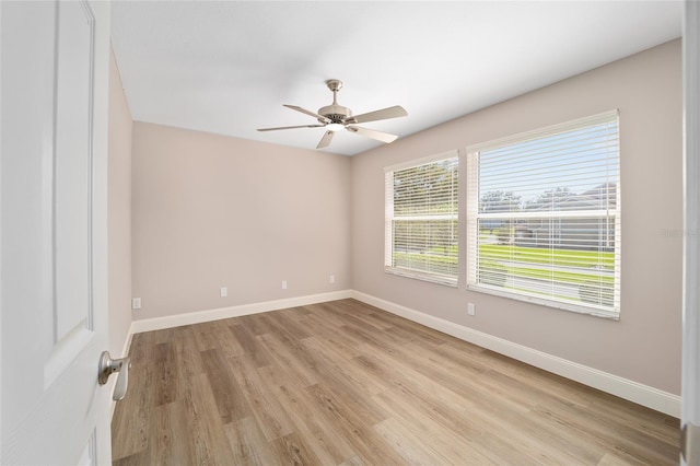 unfurnished room with ceiling fan and light hardwood / wood-style flooring