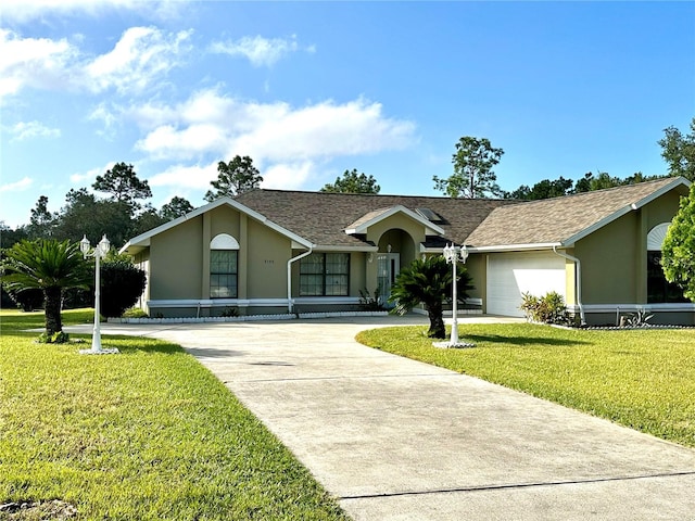 ranch-style home with a front lawn and a garage