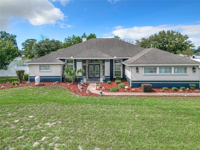 single story home with a front lawn