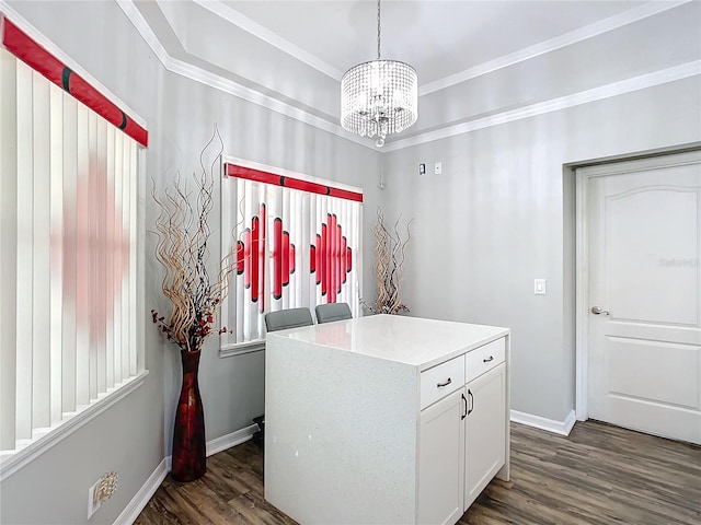 washroom with dark wood-type flooring, ornamental molding, and an inviting chandelier