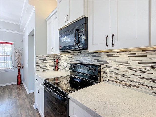 kitchen with tasteful backsplash, crown molding, dark hardwood / wood-style flooring, white cabinets, and black appliances