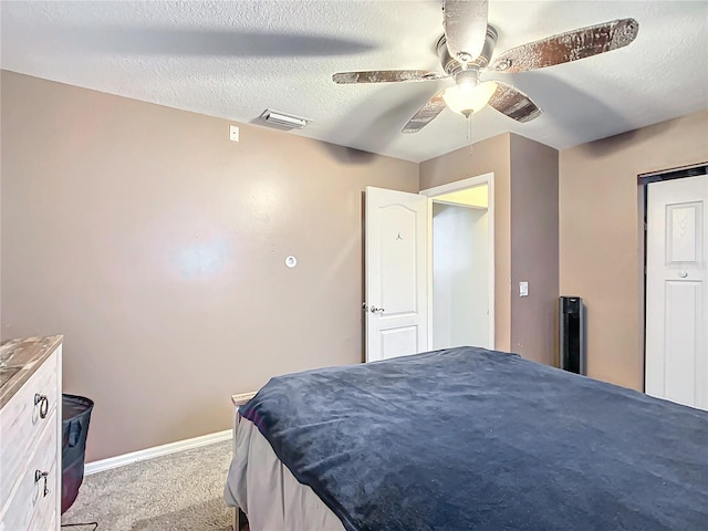 bedroom with light carpet, a textured ceiling, and ceiling fan