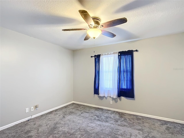 spare room with carpet, a textured ceiling, and ceiling fan