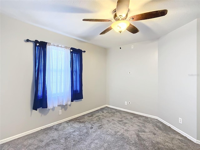 unfurnished room featuring ceiling fan and carpet flooring