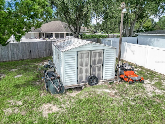 view of outdoor structure featuring a lawn