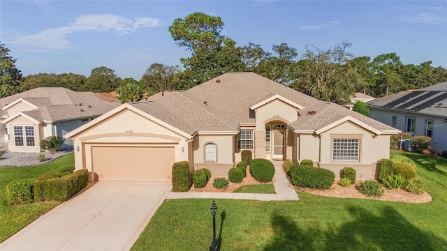 ranch-style home with a garage and a front yard