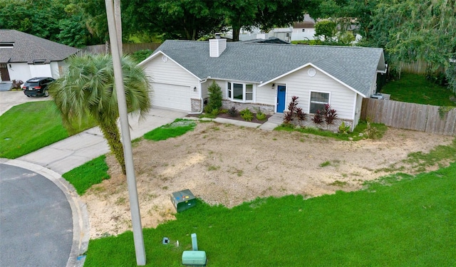 single story home featuring a front yard and a garage