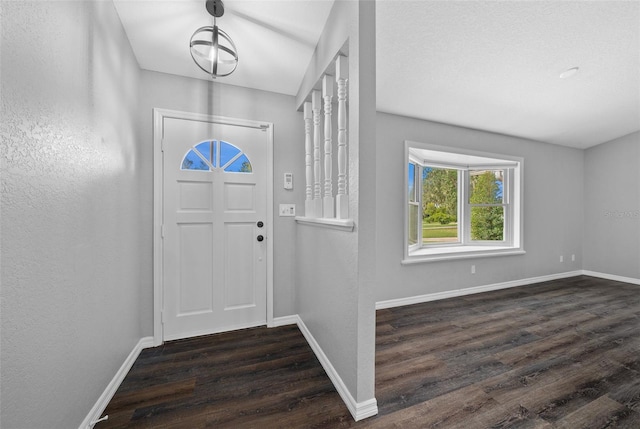 foyer with dark hardwood / wood-style floors