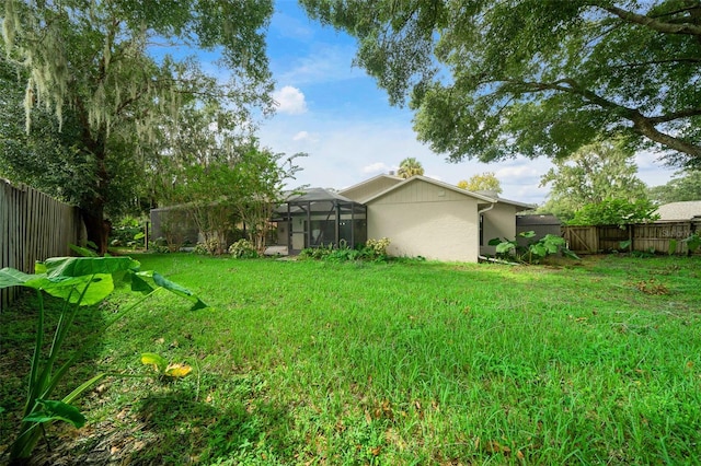 view of yard featuring a lanai