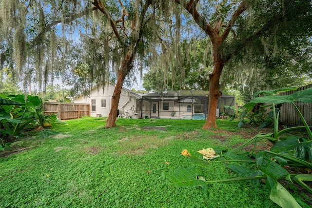 view of yard with a lanai