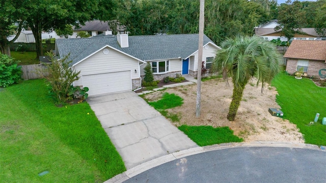 view of front facade with a front lawn and a garage