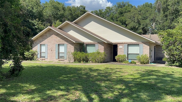 view of front of property featuring a garage and a front lawn