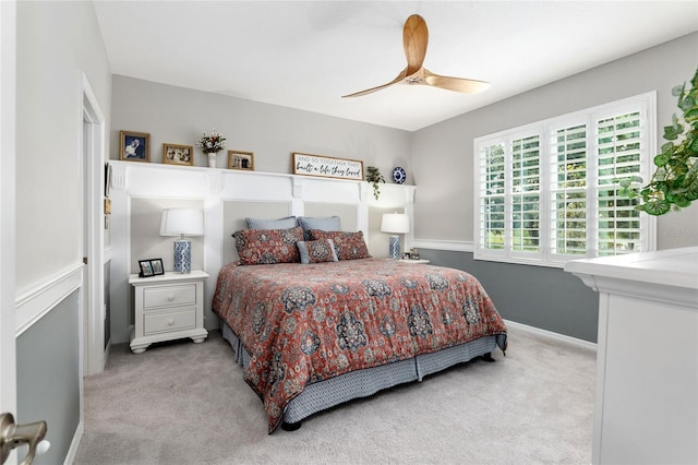 bedroom with ceiling fan and light colored carpet