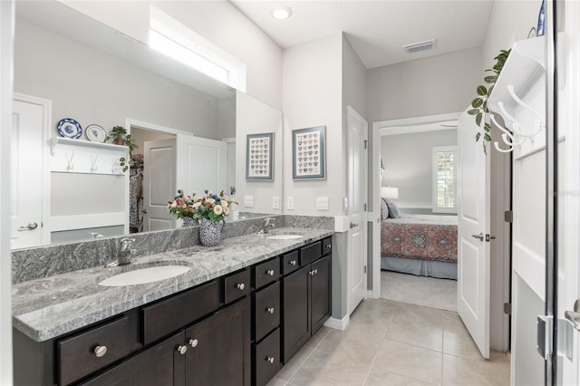 bathroom featuring vanity and tile patterned flooring