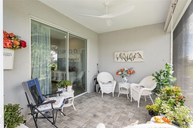 view of patio featuring ceiling fan