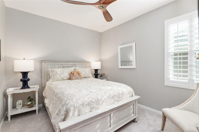 bedroom featuring light carpet and ceiling fan