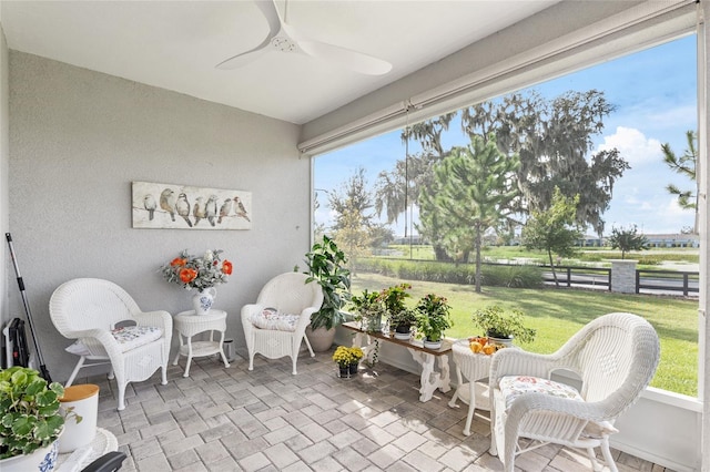 5089 Stokes Way, Wildwood, FL 34785 - sunroom featuring a ceiling fan