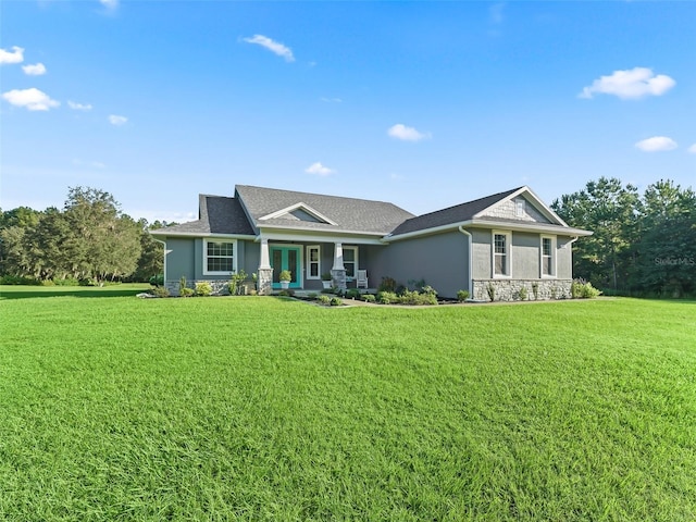 view of front of home with a porch and a front lawn