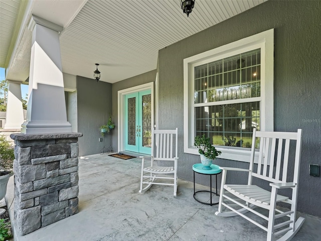 view of patio / terrace featuring french doors and covered porch