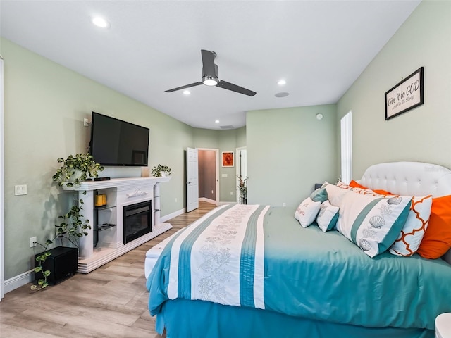 bedroom featuring hardwood / wood-style floors and ceiling fan