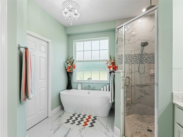 bathroom featuring shower with separate bathtub, vanity, and a notable chandelier