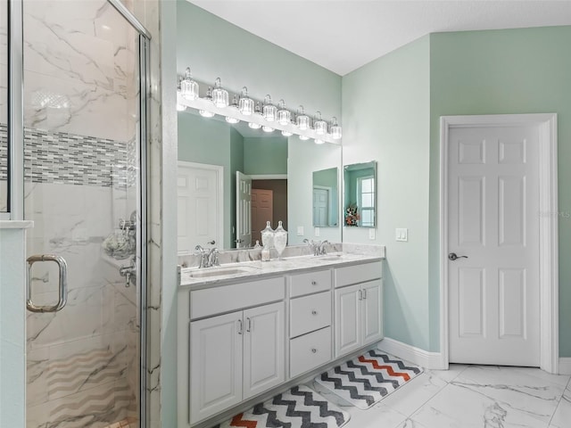 bathroom with a shower with door and vanity