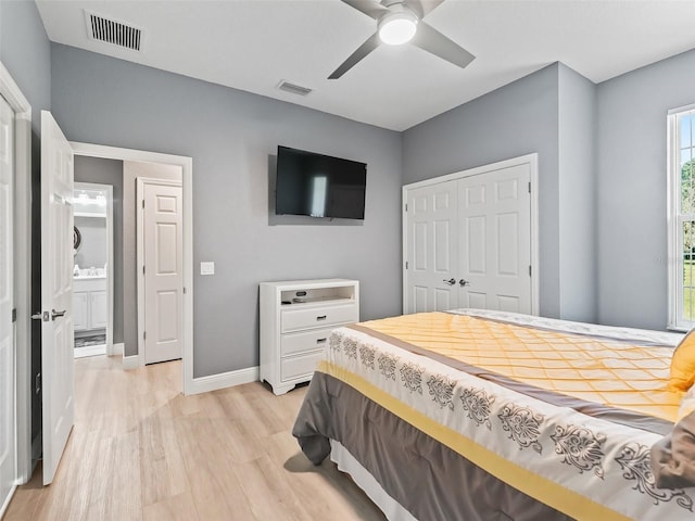 bedroom featuring a closet, light hardwood / wood-style floors, and ceiling fan