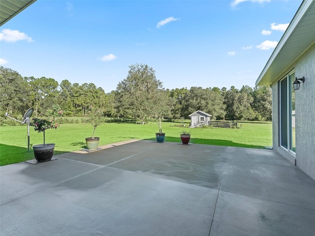 view of patio with a storage shed