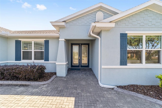 entrance to property featuring french doors