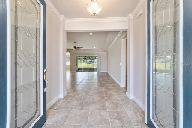 entryway with ceiling fan, crown molding, and light tile patterned floors