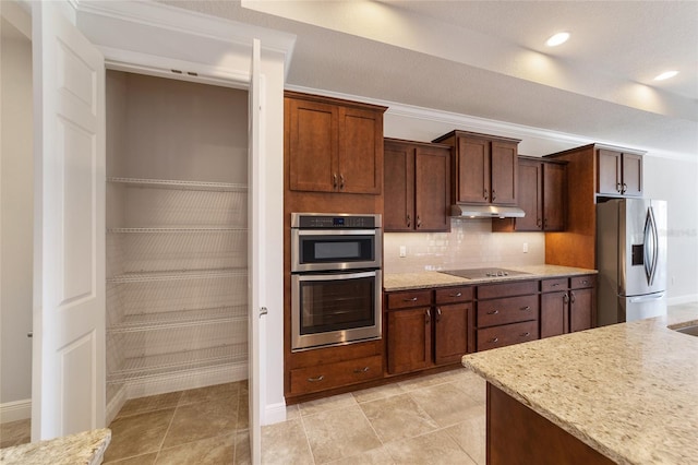 kitchen with light tile patterned floors, crown molding, stainless steel appliances, and light stone countertops