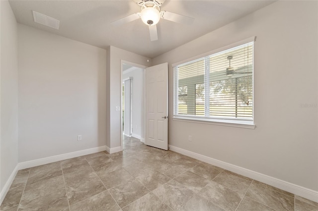 spare room featuring ceiling fan